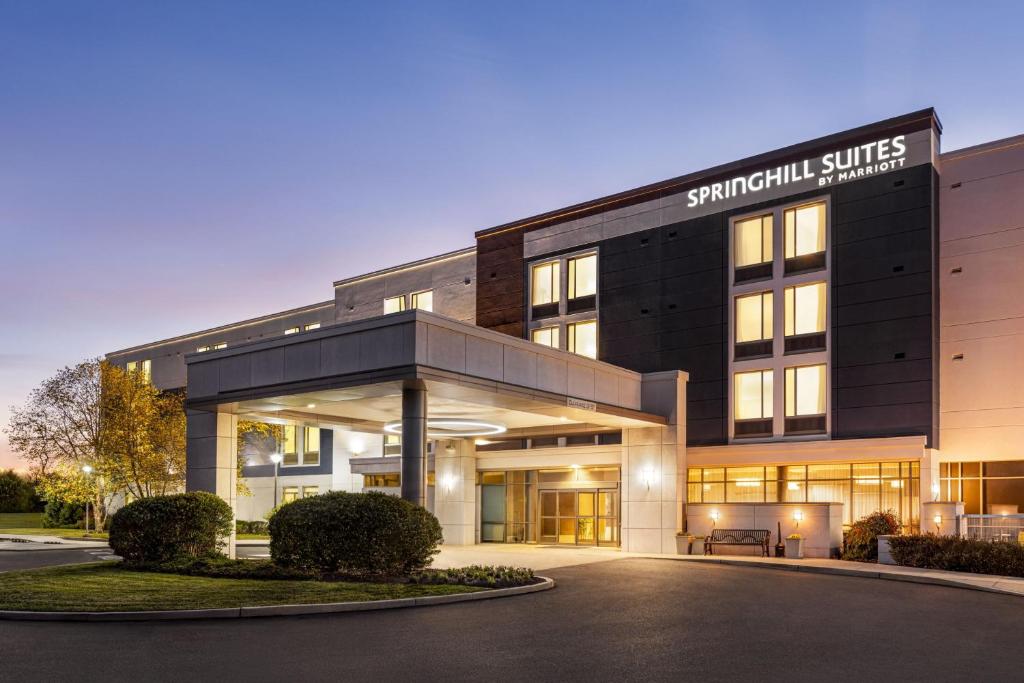 a building with a sign that reads singular suites at SpringHill Suites Ewing Township Princeton South in Ewing