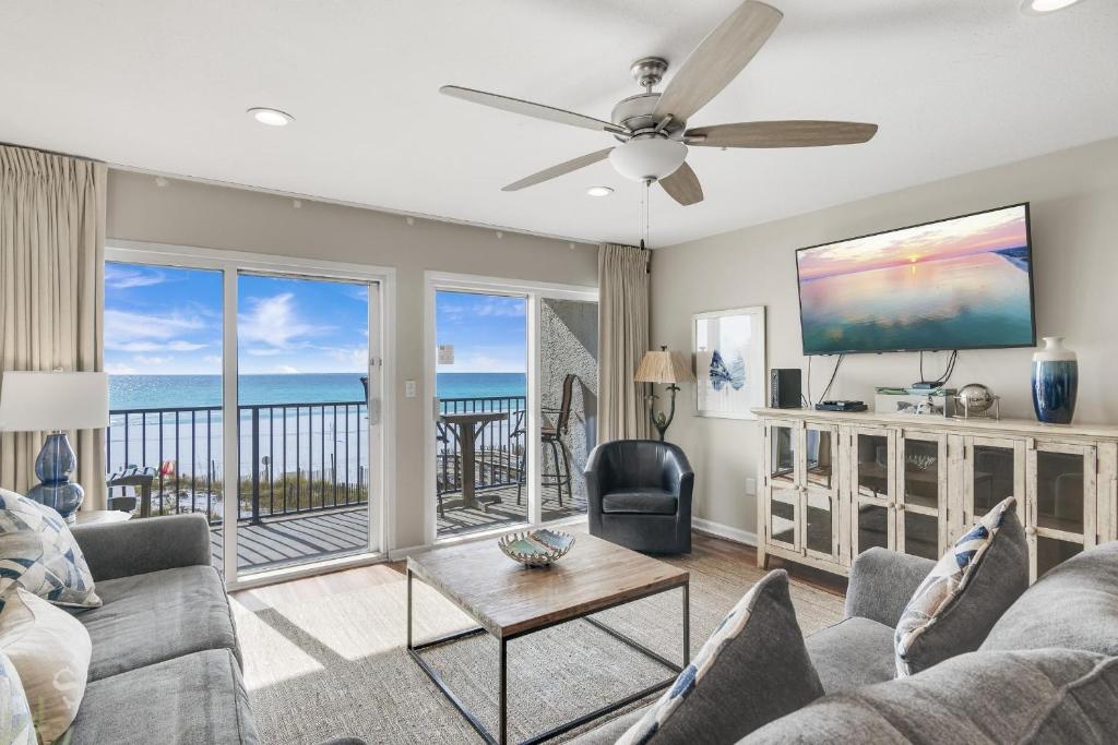 a living room with a view of the ocean at Windancer 211 in Destin