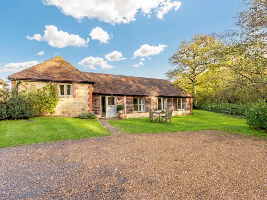 an old brick house with a grass yard at 2 Bed in Midhurst 88938 in Midhurst