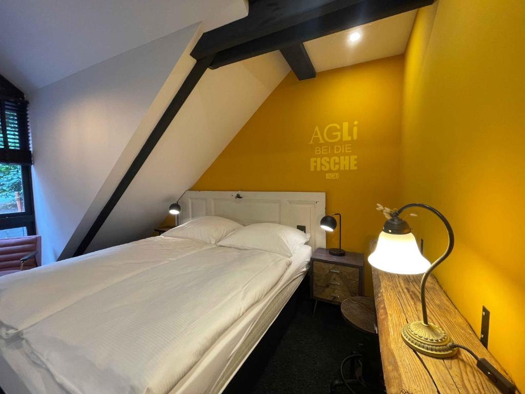 Postel nebo postele na pokoji v ubytování Agli Hotel