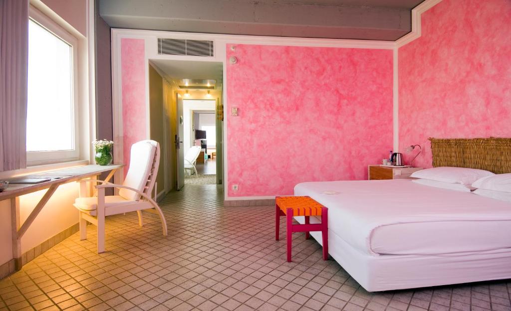 A bed or beds in a room at The Marmara Antalya