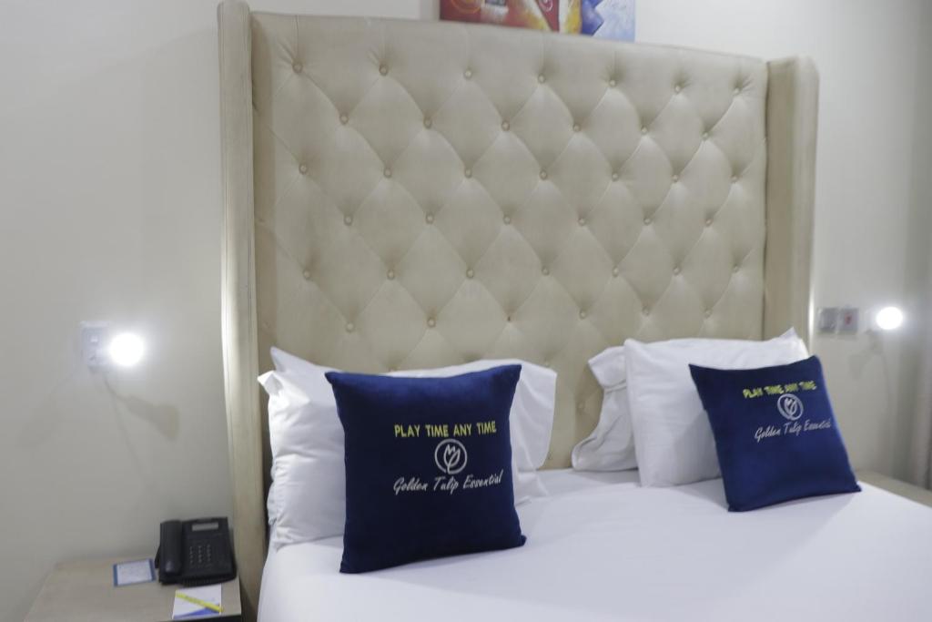 Postel nebo postele na pokoji v ubytování Golden Tulip Hotel- Evergreen Port Harcourt