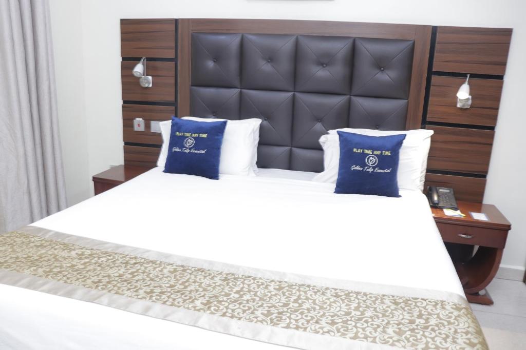 Postel nebo postele na pokoji v ubytování Golden Tulip Hotel- Evergreen Port Harcourt