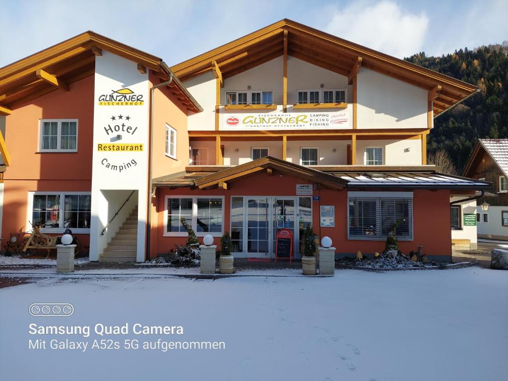 a picture of the swiss guild center in the snow at Fischerhof Glinzner Hotel-Restaurant-Camping in Afritz