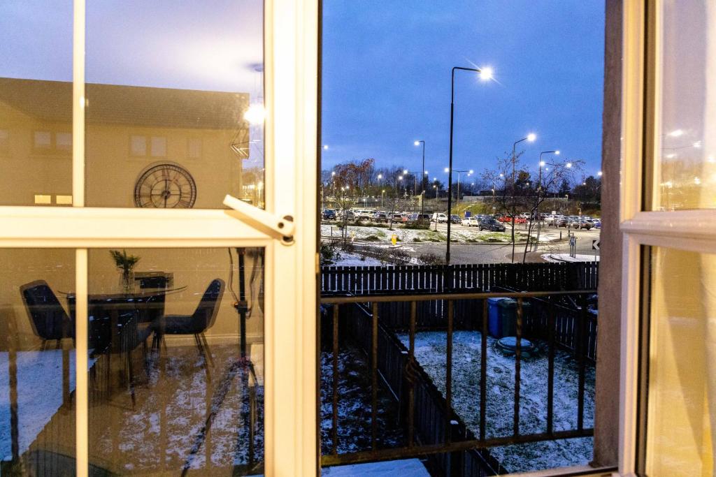 an open window with a view of a city street at Livingston North Station Apartments in Livingston