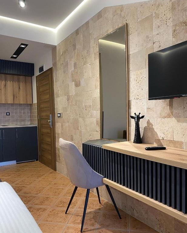 TV a/nebo společenská místnost v ubytování Hotel Comfort & Villas
