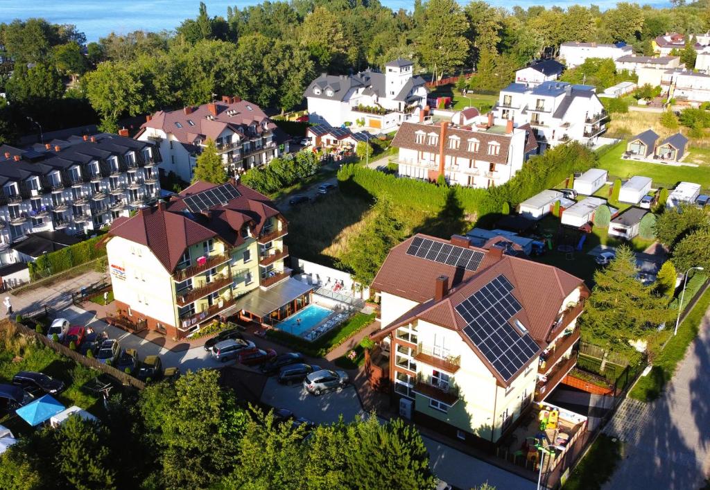 an aerial view of a house with solar panels on its roof at Antalya Pokoje i Apartamenty in Władysławowo