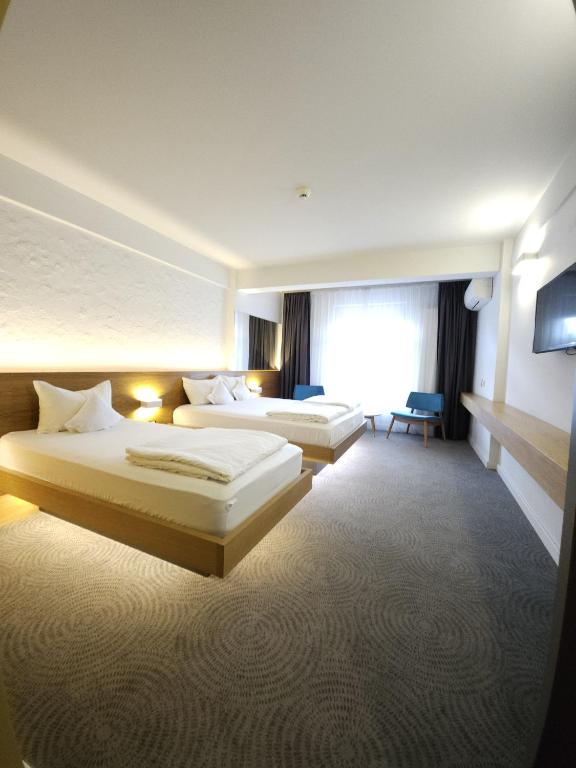 Uma cama ou camas num quarto em Hotel Silva