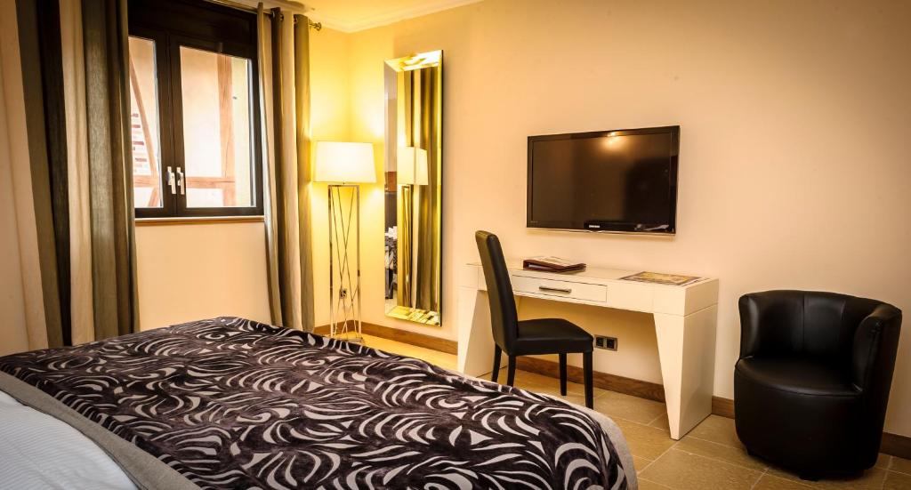 Postel nebo postele na pokoji v ubytování Les Saules Parc & Spa - Teritoria