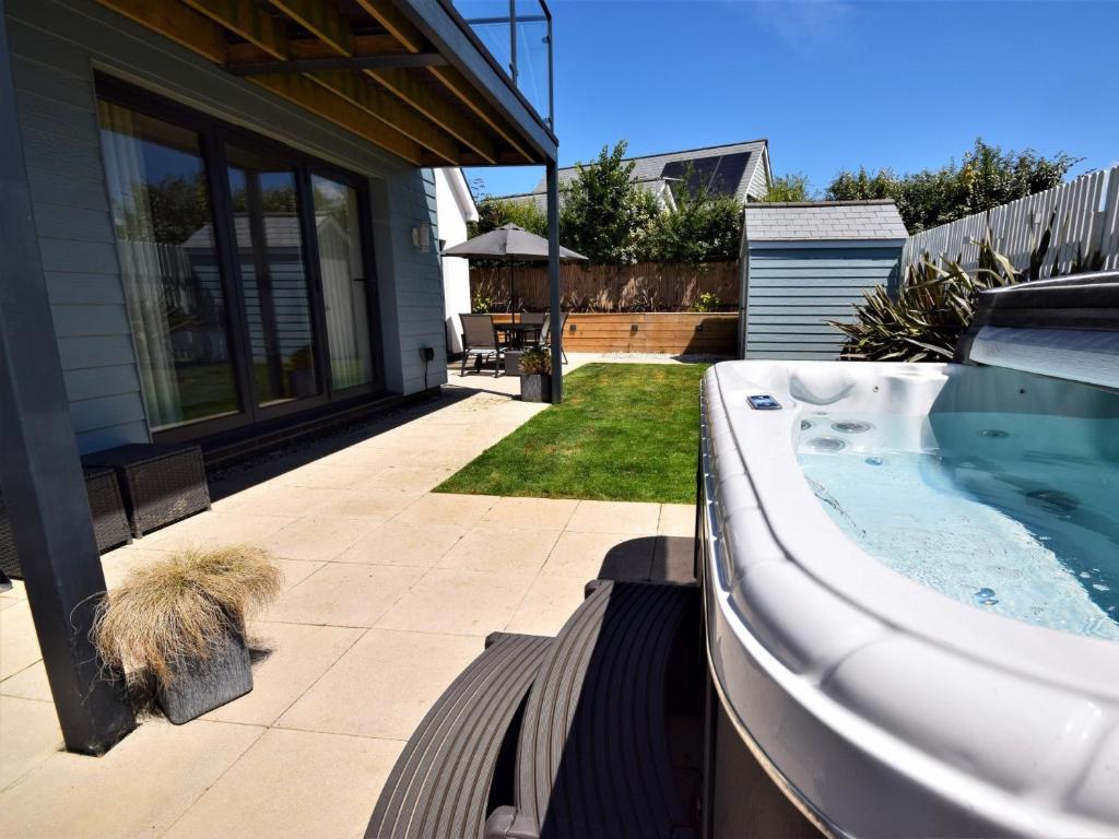 a hot tub in the backyard of a house at 3 Bed in Westward Ho 76533 in Northam