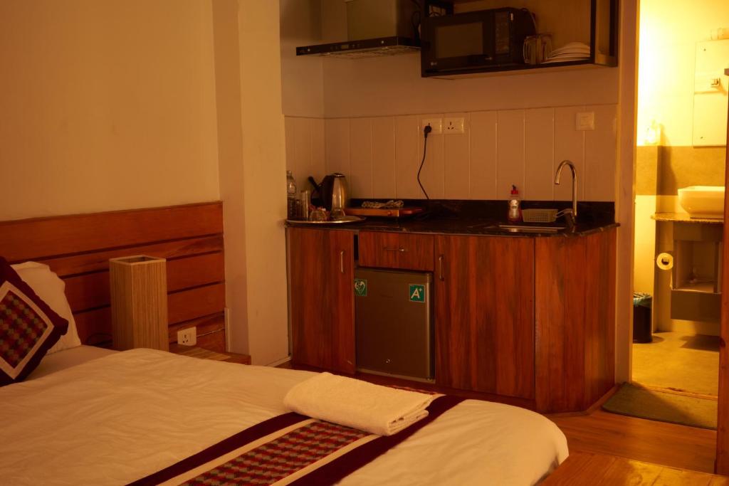 Postel nebo postele na pokoji v ubytování Subha Casa Hotel