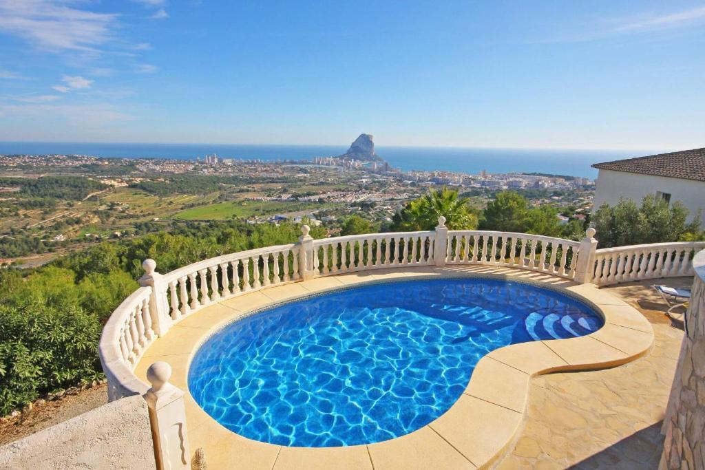 a swimming pool on top of a house at Villa Lehman - PlusHolidays in Calpe