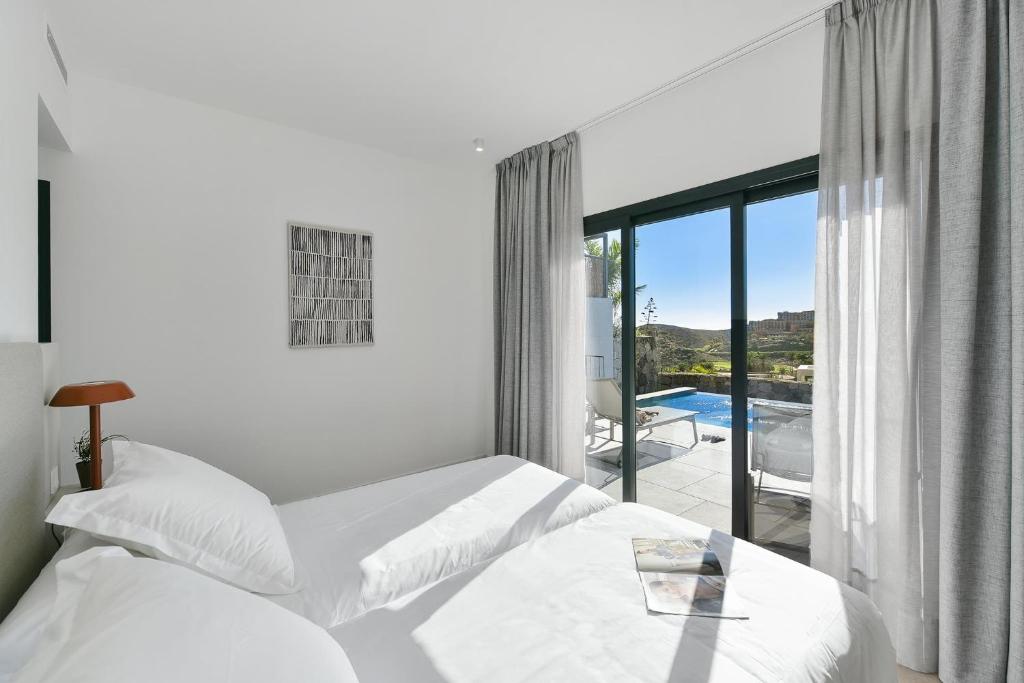 Postel nebo postele na pokoji v ubytování Las Yucas 1 by VillaGranCanaria