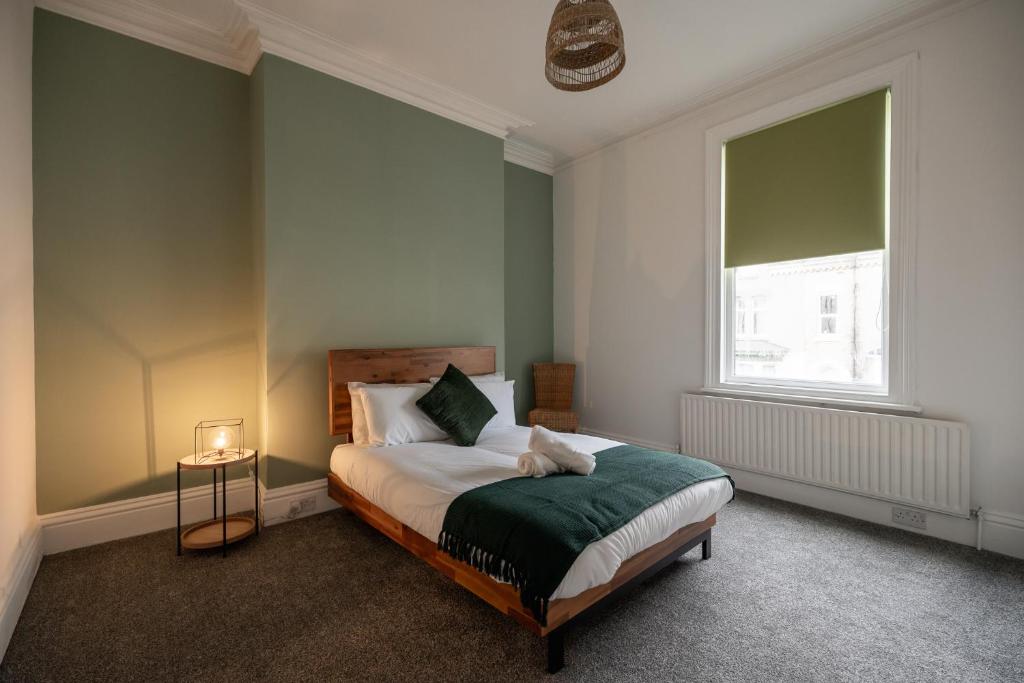 a bedroom with a bed and a window at Grange House by Horizon Stays in Hartlepool
