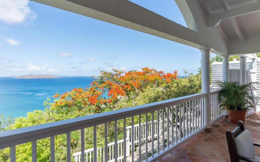 a porch with a view of the ocean at Saint Barth Villa 15 in Pointe Milou