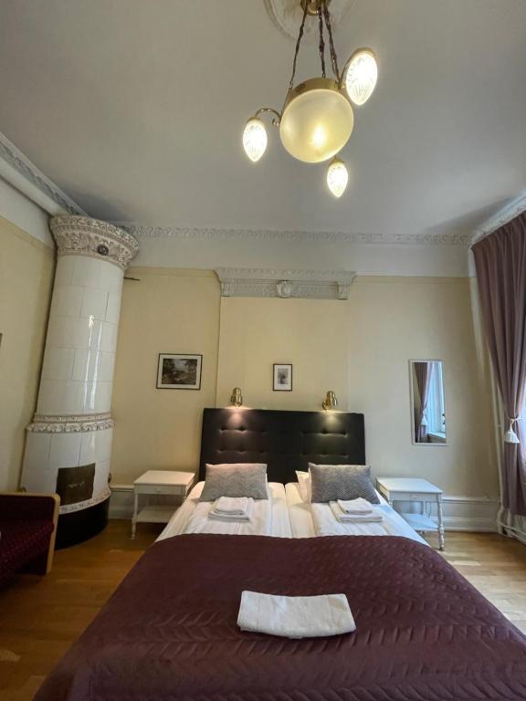 Postel nebo postele na pokoji v ubytování Lilla Hotellet