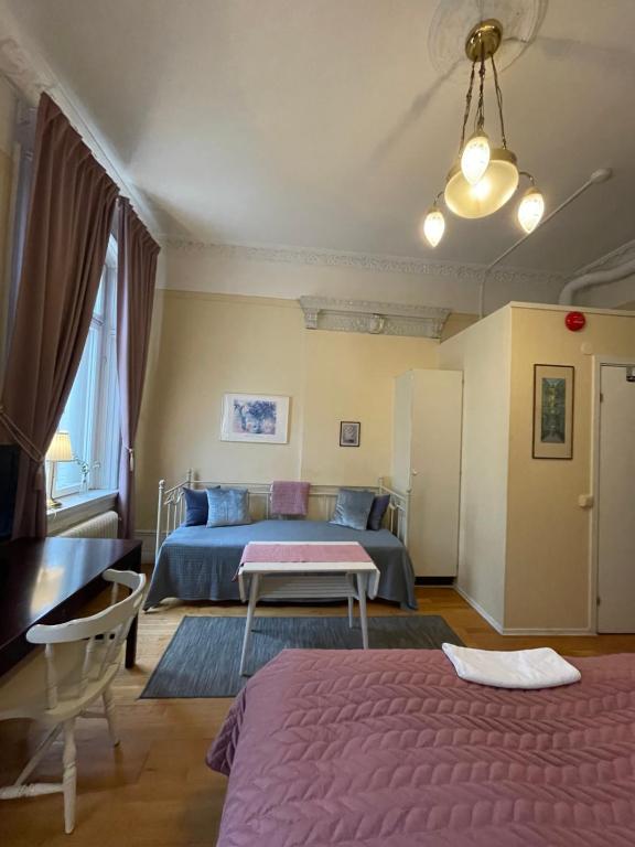 Postel nebo postele na pokoji v ubytování Lilla Hotellet
