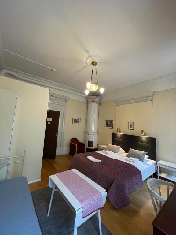 Postel nebo postele na pokoji v ubytování Lilla Hotellet