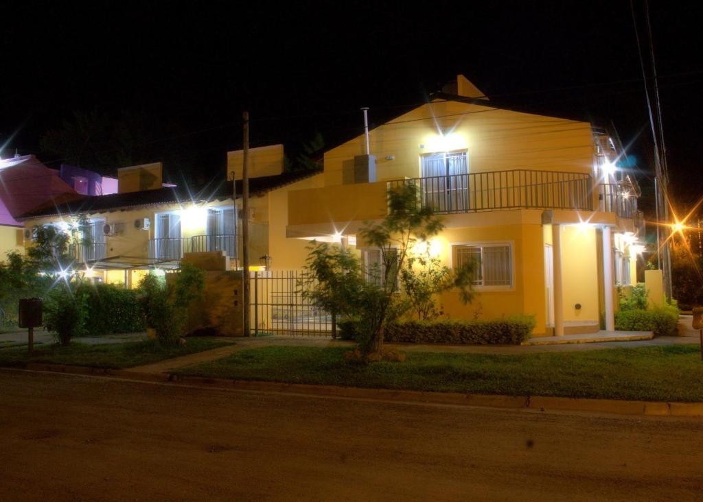a house lit up at night with lights at Balcones del Pilar in Colón