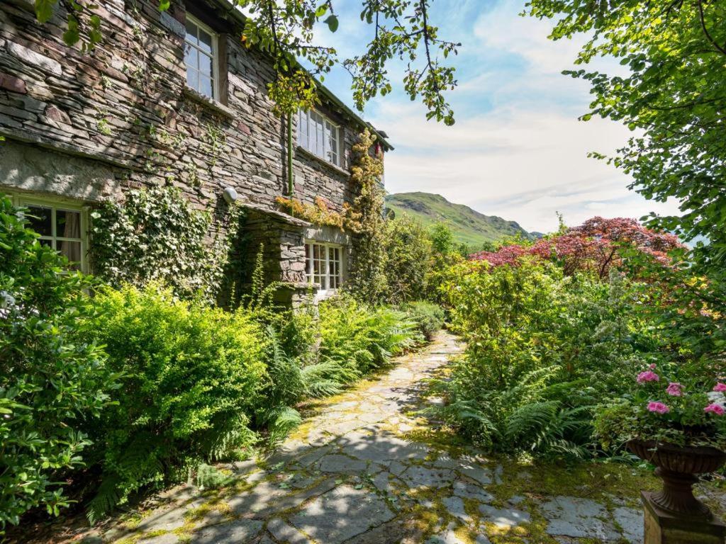 a stone house with a garden in front of it at 2 Bed in Patterdale SZ210 in Patterdale