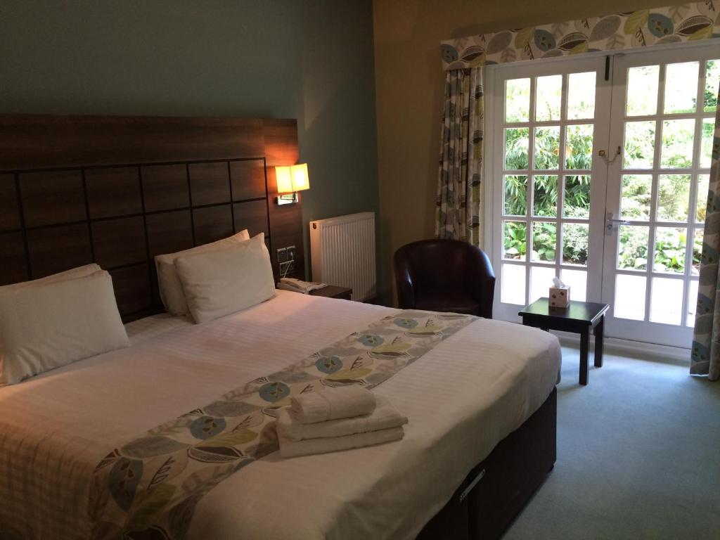 Postel nebo postele na pokoji v ubytování Quorn Grange Hotel