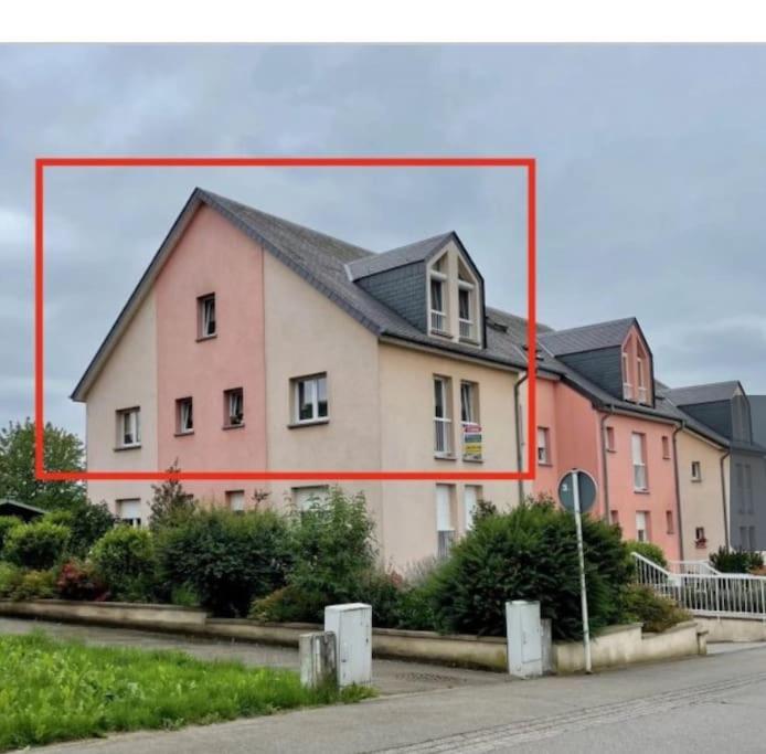 a large house with a red frame around it at Wonderful Duplex in Luxembourg in Pétange