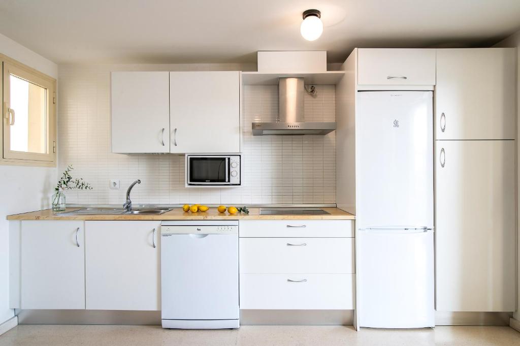 A kitchen or kitchenette at Pierre & Vacances Sevilla