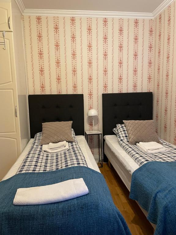 Postel nebo postele na pokoji v ubytování Lilla Hotellet