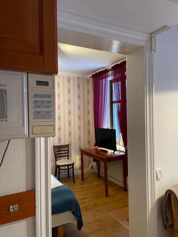 TV a/nebo společenská místnost v ubytování Lilla Hotellet