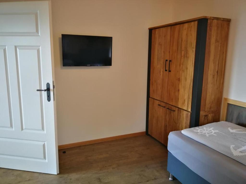 Postel nebo postele na pokoji v ubytování Boddenkutter