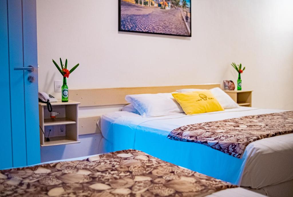 Cama ou camas em um quarto em Pousada Portal da Concha