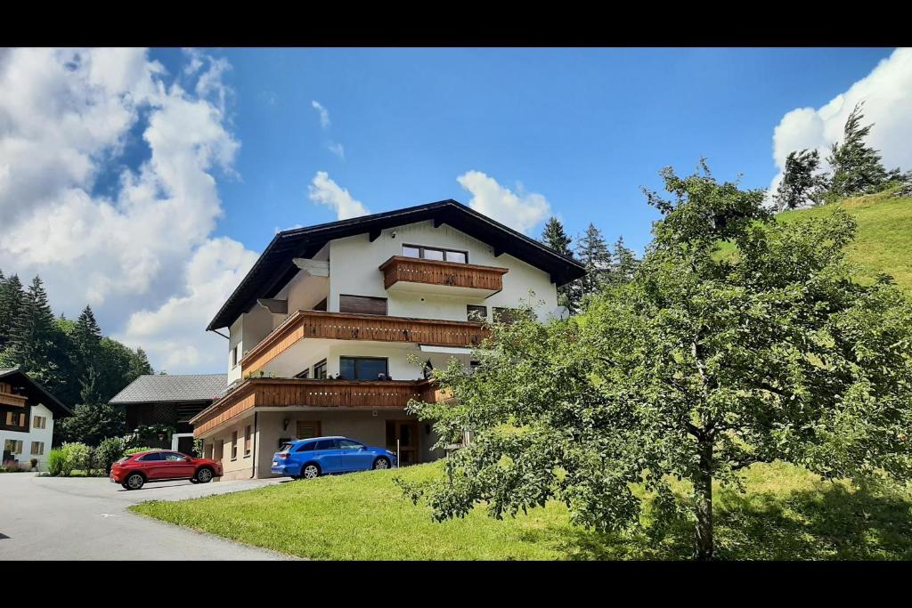 a large building with cars parked in front of it at Ferienwohnung Tschagguns in Schruns