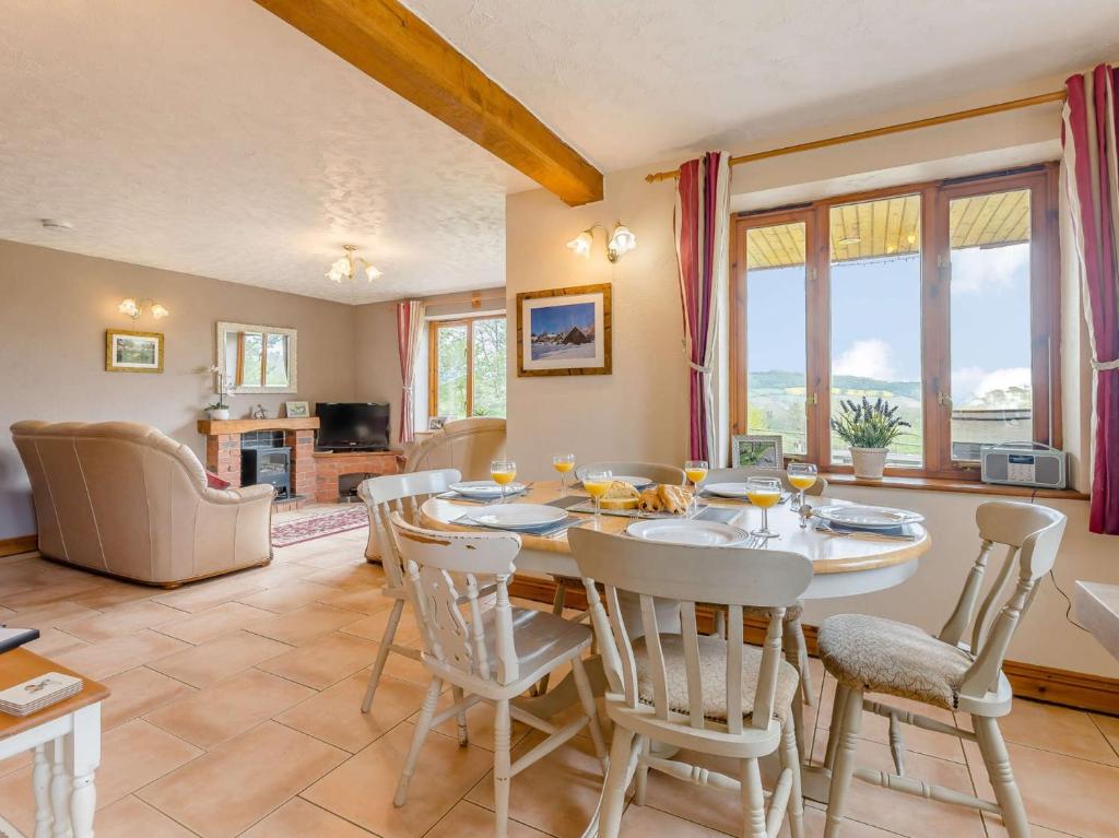 a dining room with a table and chairs at 3 bed in Worcester CC037 in Clifton upon Teme