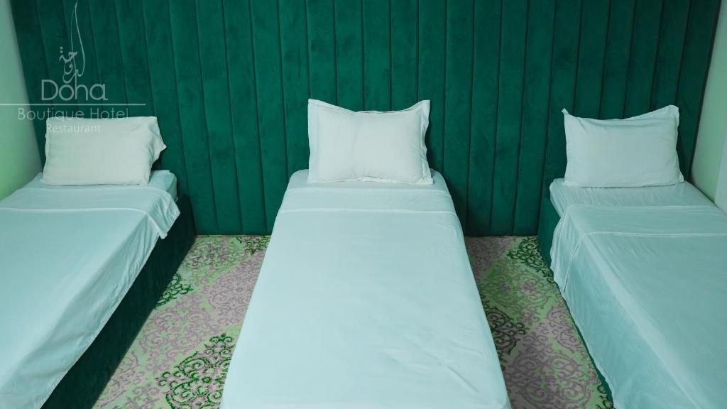 Postel nebo postele na pokoji v ubytování Aparthotel & Hotel Doha