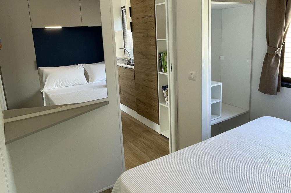 Postel nebo postele na pokoji v ubytování Le Dune Villaggio