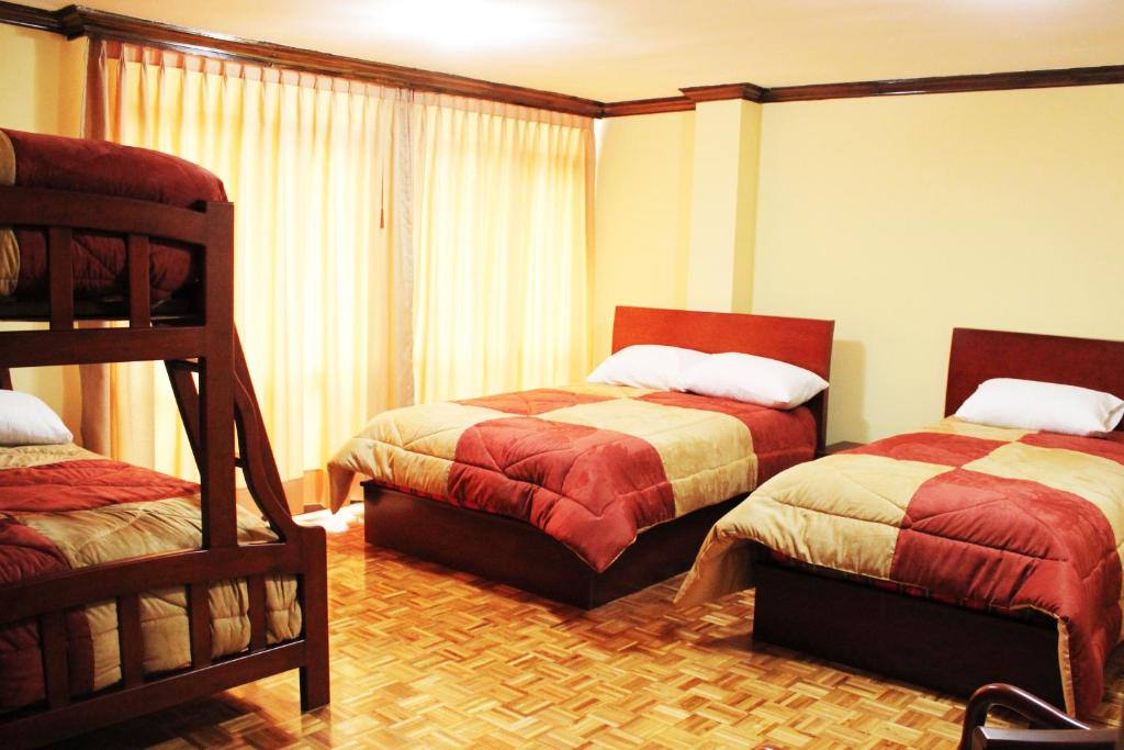 Postel nebo postele na pokoji v ubytování Hotel Villa Lafayette