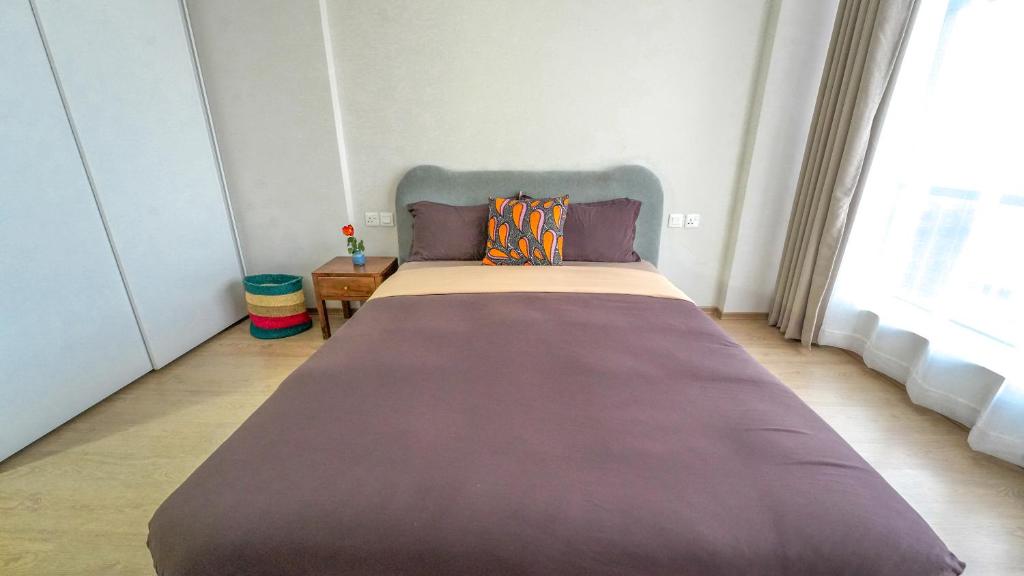 Postel nebo postele na pokoji v ubytování Elite One Bedroom Apartment,Swimming pool, gym, workspace ,Wonderiss Homes close proximity to GTC, JW Mariott and Kempinski