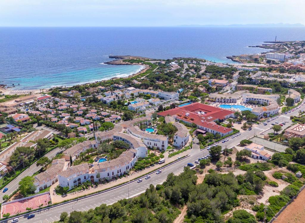 an aerial view of a resort next to the ocean at Sol Falco in Son Xoriguer