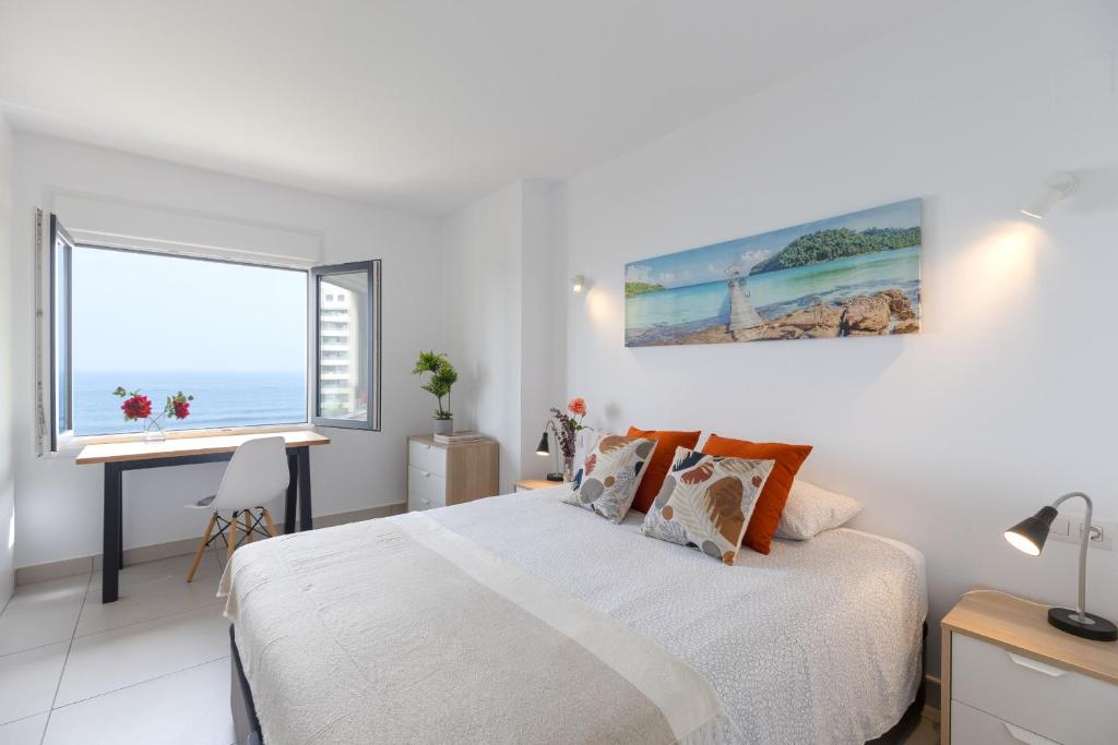 A bed or beds in a room at Fidalsa Paradise Sea Punta Prima