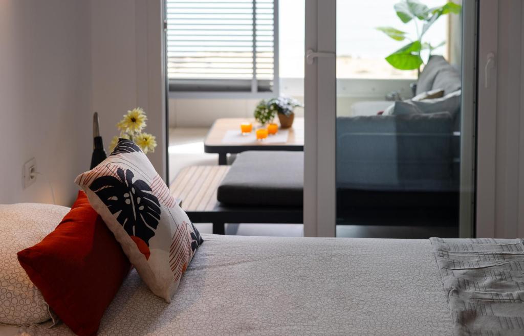 A bed or beds in a room at Fidalsa Paradise Sea Punta Prima