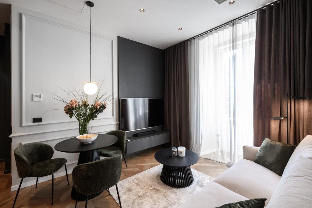 Et sittehjørne på Luxury Apartment con terrazzo su Piazza Oberdan