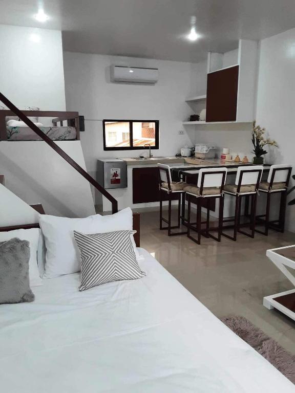 Postel nebo postele na pokoji v ubytování PMPJ Apartment