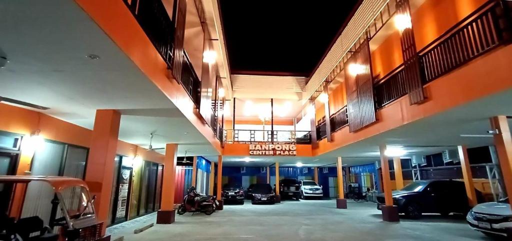 a view of a garage with cars parked in it at Banpong Center Place in Ban Khung Phayom