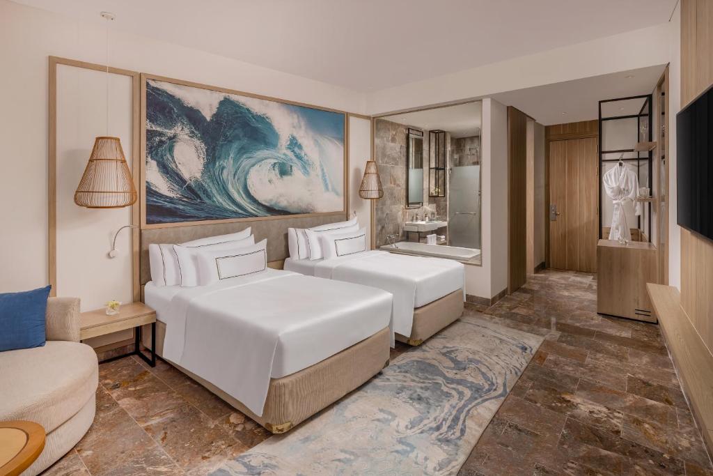 Postel nebo postele na pokoji v ubytování Melia Danang Beach Resort