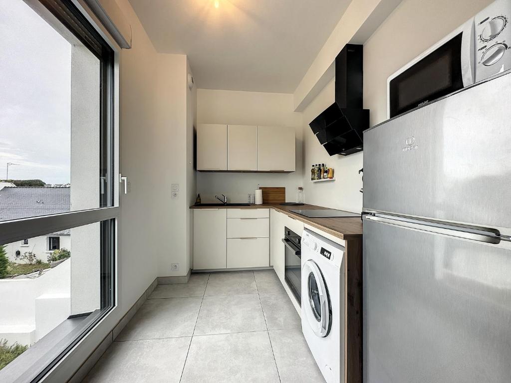 Kuchyň nebo kuchyňský kout v ubytování Le 121 - Appartement 101