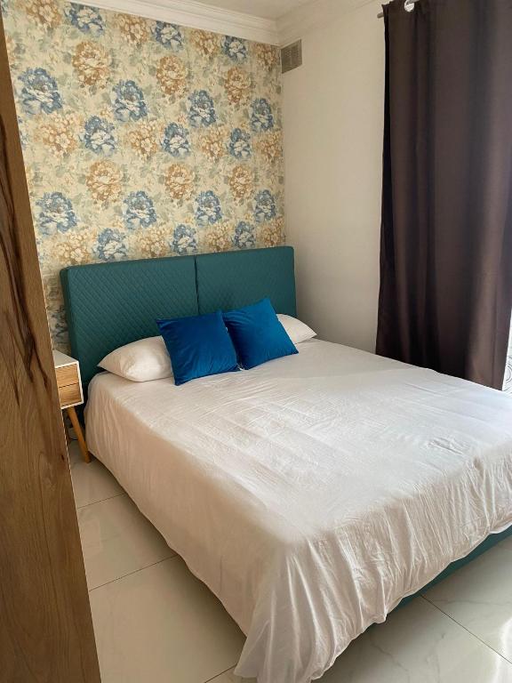Postel nebo postele na pokoji v ubytování Zenith Apartment A20