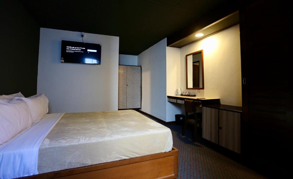 Postel nebo postele na pokoji v ubytování Fata Hotel by Project Borneo