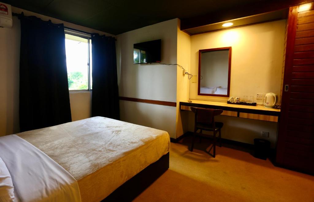 Postel nebo postele na pokoji v ubytování Fata Hotel by Project Borneo