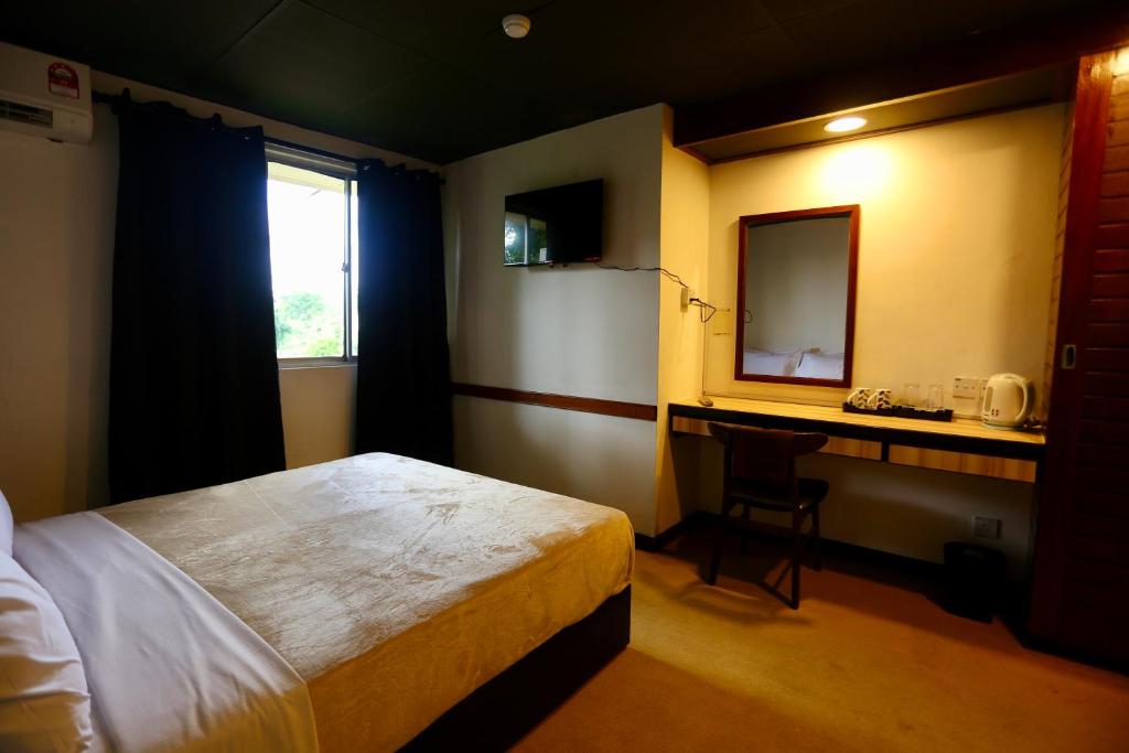 Postel nebo postele na pokoji v ubytování Fata Hotel by Project Borneo