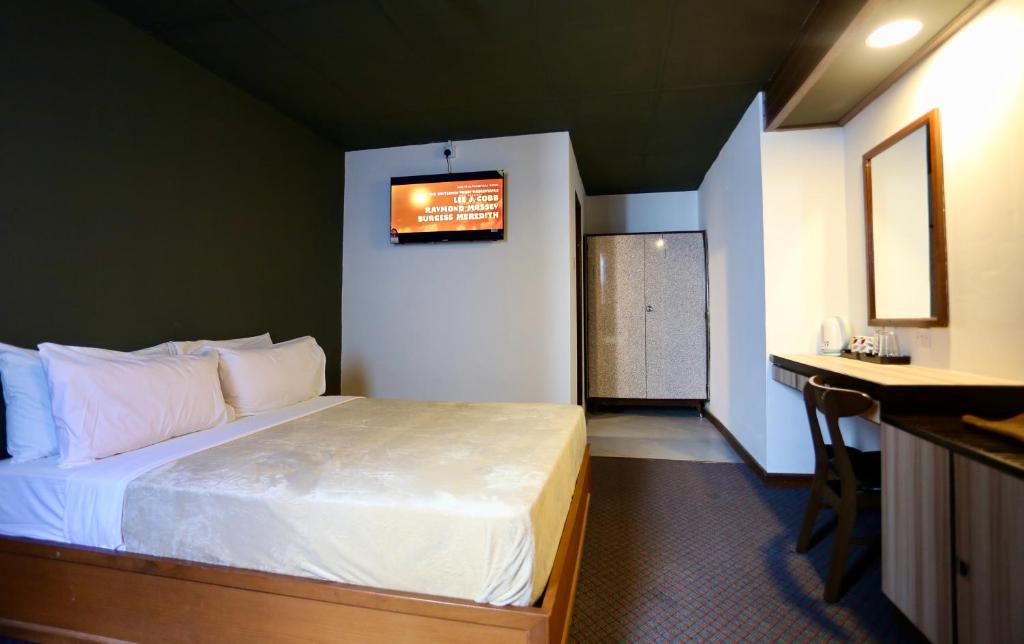 Postel nebo postele na pokoji v ubytování Fata Hotel by Project Borneo
